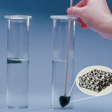 Charcoal floats on top of the water due to its hollow structure